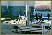 Pouring and placing concrete using the newly-installed overhead crane system.